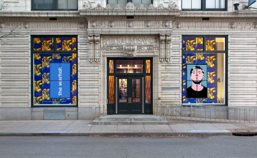 Entryway to a museum, flanked by two windows